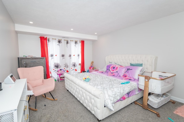 carpeted bedroom with recessed lighting