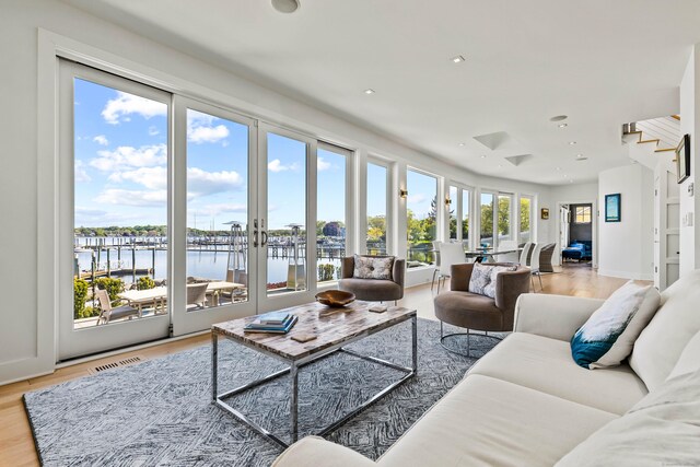 52 Old N Rd, Stonington, CT 06355 - living room with a water view, recessed lighting, light wood-style floors, and baseboards
