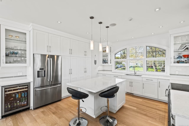 52 Old N Rd, Stonington, CT 06355 - kitchen featuring stainless steel appliances, wine cooler, a sink, tasteful backsplash, and recessed lighting