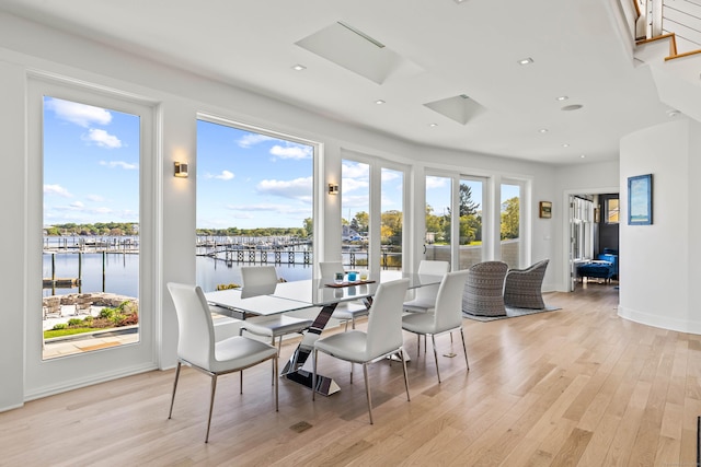 52 Old N Rd, Stonington, CT 06355 - dining area featuring light wood-style floors, a water view, recessed lighting, and stairway