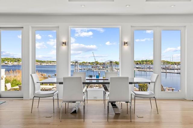 52 Old N Rd, Stonington, CT 06355 - dining space with wood finished floors, a water view, and recessed lighting
