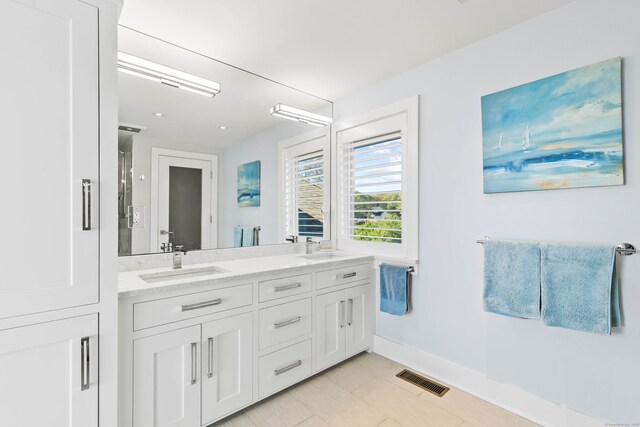 52 Old N Rd, Stonington, CT 06355 - full bathroom featuring baseboards and double vanity
