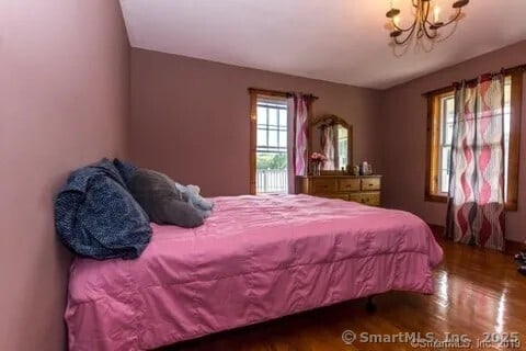 31 Bayberry Ln, Lisbon, CT 06351 - bedroom with wood finished floors and a chandelier