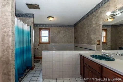 31 Bayberry Ln, Lisbon, CT 06351 - full bathroom featuring tile patterned floors, vanity, curtained shower, and wallpapered walls