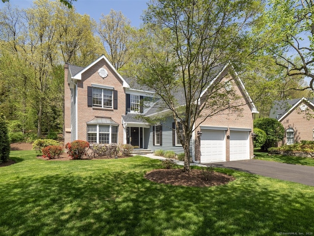 30 Wilton Hunt Rd Unit 30, Wilton, CT 06897 - traditional home featuring brick siding, asphalt driveway, and a front yard