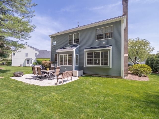 30 Wilton Hunt Rd Unit 30, Wilton, CT 06897 - back of property featuring a patio area, an outdoor fire pit, a lawn, and a chimney