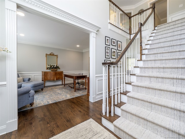 30 Wilton Hunt Rd Unit 30, Wilton, CT 06897 - stairs with ornamental molding, wood finished floors, recessed lighting, and a decorative wall