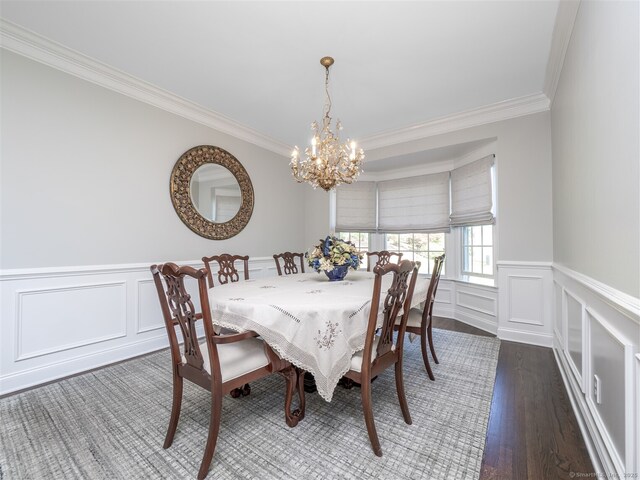 30 Wilton Hunt Rd Unit 30, Wilton, CT 06897 - dining space featuring crown molding, a chandelier, a decorative wall, wood finished floors, and a wainscoted wall
