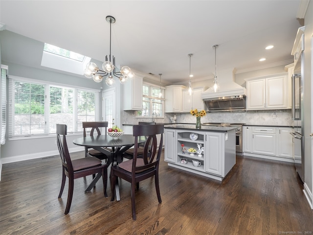30 Wilton Hunt Rd Unit 30, Wilton, CT 06897 - dining room featuring a skylight, crown molding, dark wood-style floors, a chandelier, and baseboards