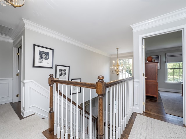 30 Wilton Hunt Rd Unit 30, Wilton, CT 06897 - hall featuring a chandelier, an upstairs landing, healthy amount of natural light, a decorative wall, and ornamental molding