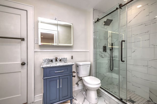 full bath featuring marble finish flooring, a marble finish shower, toilet, and vanity