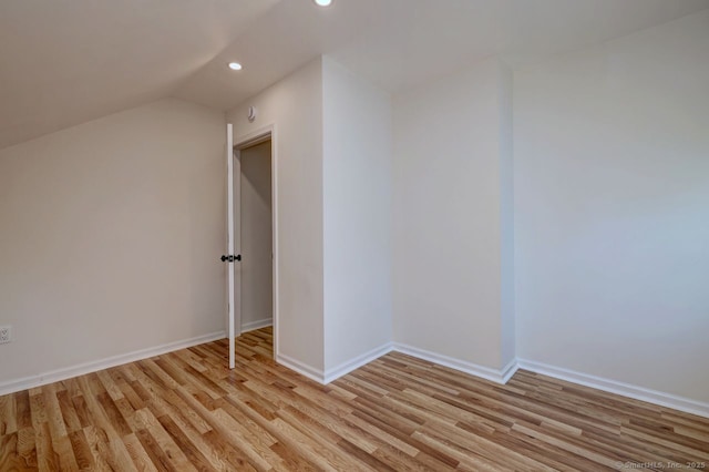 additional living space with recessed lighting, light wood finished floors, baseboards, and lofted ceiling