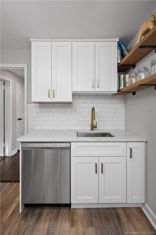 kitchen with dishwasher, a sink, white cabinetry, and dark wood-style floors