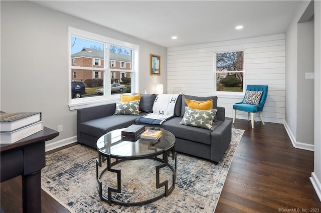 living area with wood finished floors, baseboards, and recessed lighting