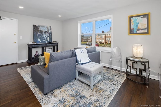 living area featuring wood finished floors, baseboards, and recessed lighting