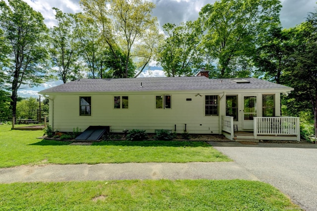 7 Parker Rd, Willington, CT 06279 - view of front facade featuring a chimney, a front yard, and a shingled roof
