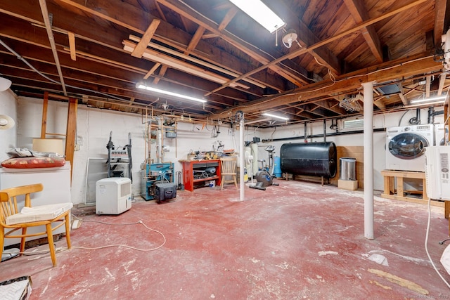 7 Parker Rd, Willington, CT 06279 - unfinished basement featuring oil tank, washing machine and clothes dryer, and a heating unit