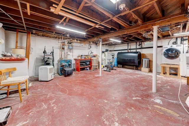 7 Parker Rd, Willington, CT 06279 - unfinished below grade area with oil tank, a heating unit, and independent washer and dryer