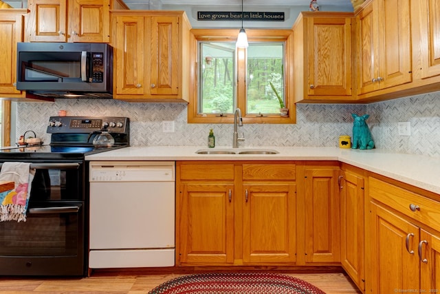 7 Parker Rd, Willington, CT 06279 - kitchen featuring black microwave, double oven range, dishwasher, a sink, and light wood finished floors