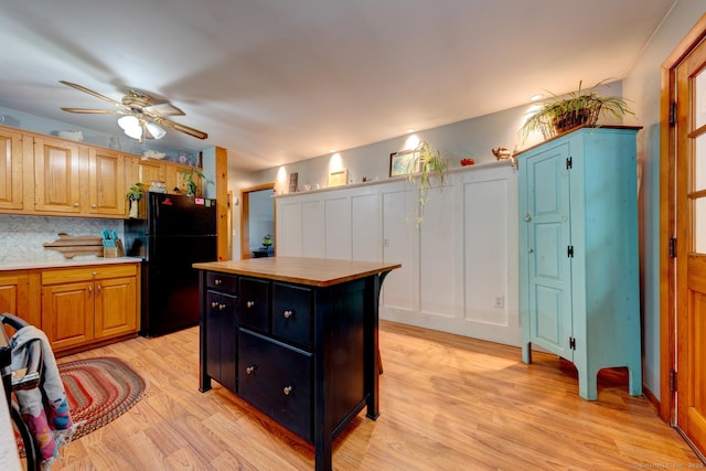 7 Parker Rd, Willington, CT 06279 - kitchen with freestanding refrigerator, a ceiling fan, light wood-style floors, light countertops, and decorative backsplash