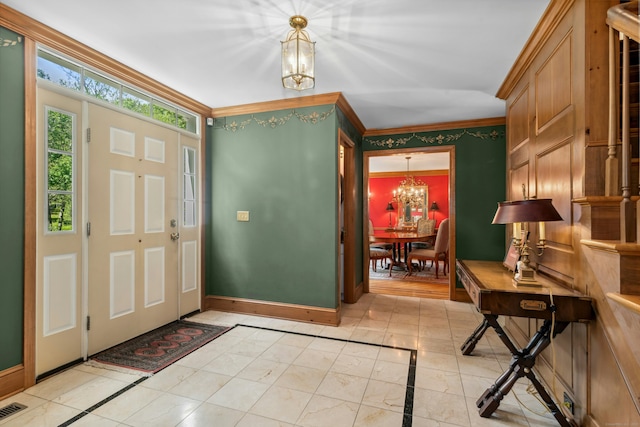 6 Galilee Way, Newtown, CT 06470 - entrance foyer with a chandelier, inlaid floor details, baseboards, and crown molding