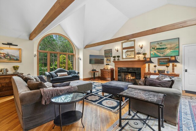 6 Galilee Way, Newtown, CT 06470 - living area with wood finished floors, a high end fireplace, high vaulted ceiling, beamed ceiling, and baseboards