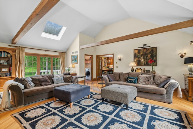 6 Galilee Way, Newtown, CT 06470 - living room with washer / clothes dryer, a skylight, wood finished floors, and high vaulted ceiling