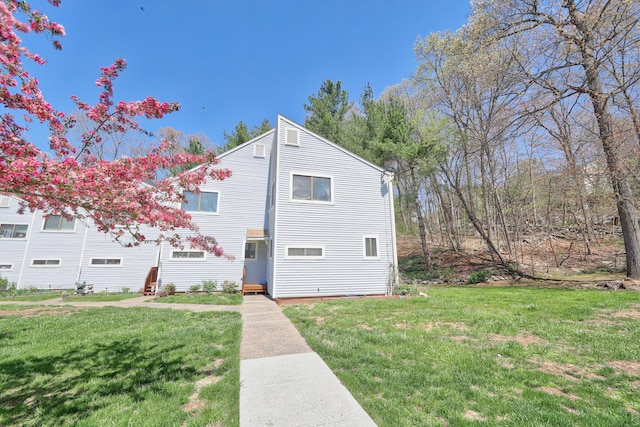 view of front of home with a front lawn
