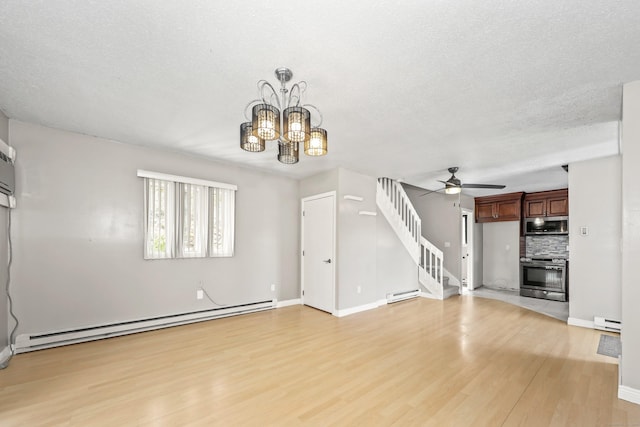 unfurnished living room featuring a baseboard radiator, light wood-style floors, stairway, a ceiling fan, and a textured ceiling