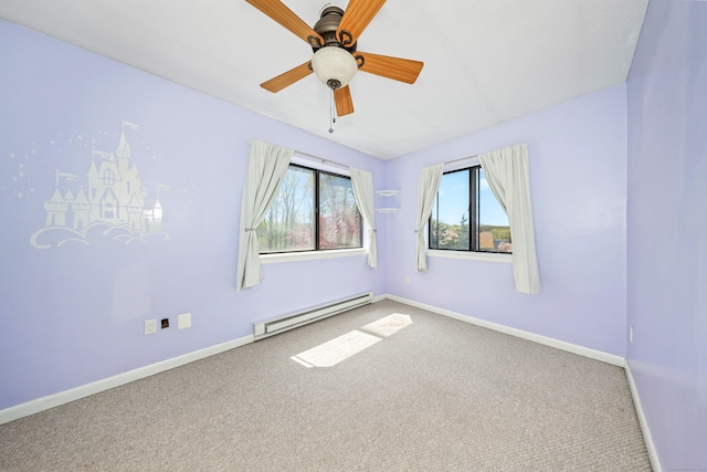 carpeted empty room featuring a baseboard heating unit, baseboards, and a ceiling fan
