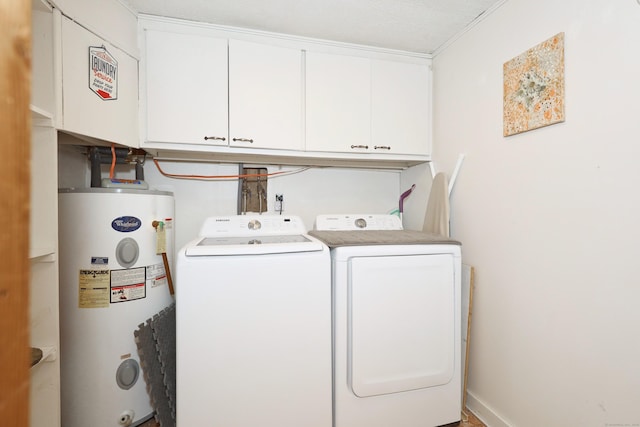 laundry area featuring water heater, washer and clothes dryer, and cabinet space