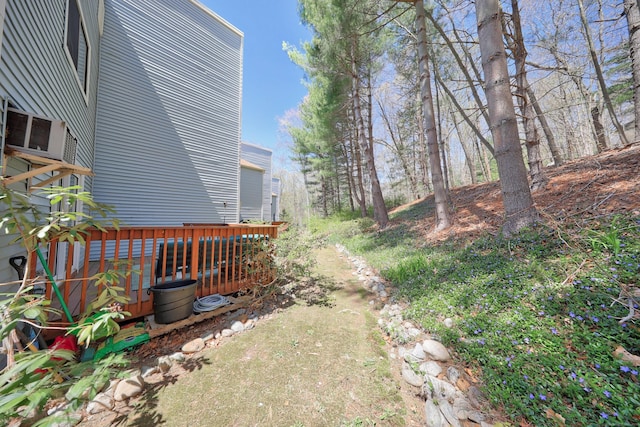 view of yard featuring a wooden deck