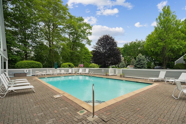 44 Hale Ln, Darien, CT 06820 - community pool featuring a patio and view of wooded area