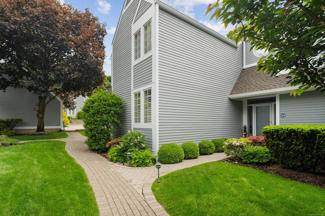44 Hale Ln, Darien, CT 06820 - view of home's exterior with a yard and a shingled roof