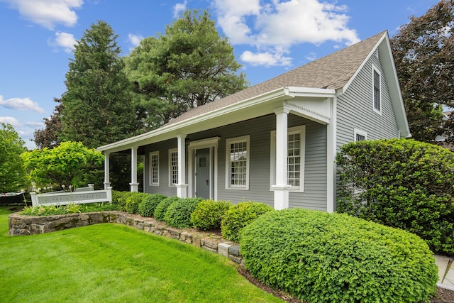 44 Hale Ln, Darien, CT 06820 - view of front of house with a front lawn, a shingled roof, and covered porch