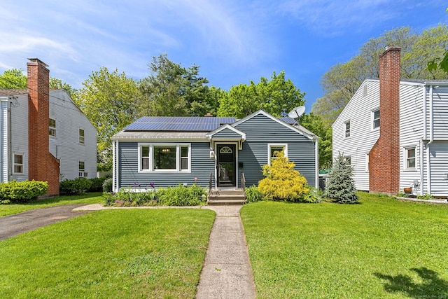 173 Columbia St, New Britain, CT 06052 - view of front of house featuring a front lawn and solar panels