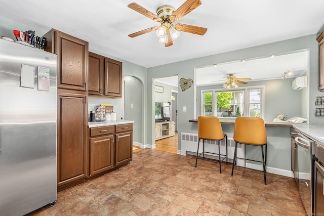 173 Columbia St, New Britain, CT 06052 - kitchen featuring stainless steel appliances, ceiling fan, light stone finish floors, and light countertops
