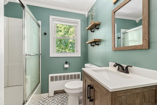 173 Columbia St, New Britain, CT 06052 - full bath with radiator heating unit, crown molding, toilet, vanity, and bath / shower combo with glass door
