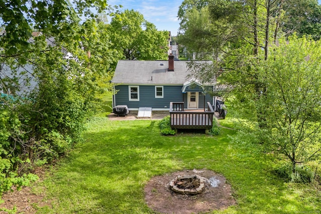 173 Columbia St, New Britain, CT 06052 - back of house with an outdoor fire pit, a yard, a wooden deck, and a chimney