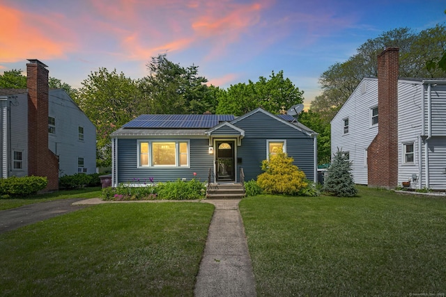 173 Columbia St, New Britain, CT 06052 - bungalow with a front yard and solar panels