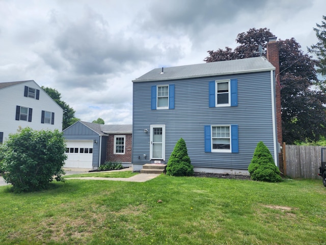12 Flyers Dr, Norwich, CT 06360 - view of front facade with a chimney and an attached garage