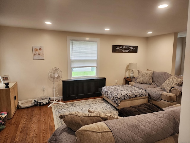 12 Flyers Dr, Norwich, CT 06360 - living area with radiator, wood finished floors, and recessed lighting
