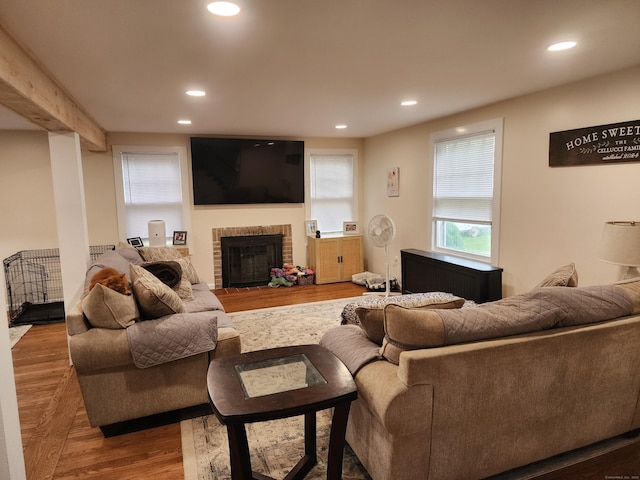 12 Flyers Dr, Norwich, CT 06360 - living area featuring recessed lighting, wood finished floors, and a brick fireplace