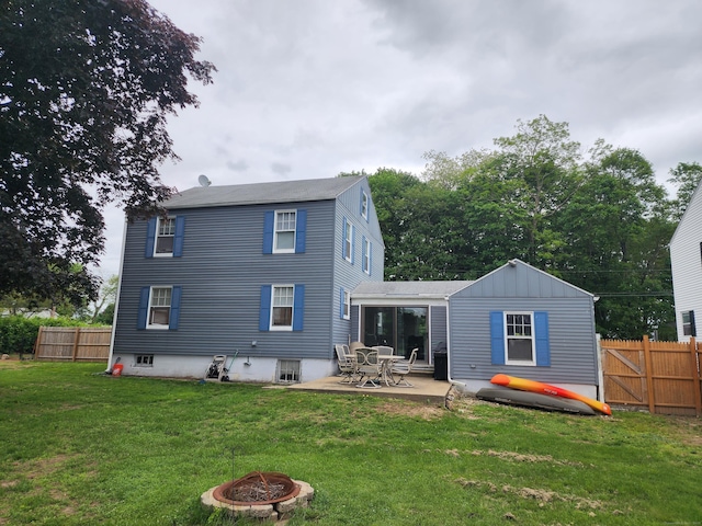 12 Flyers Dr, Norwich, CT 06360 - rear view of house with an outdoor fire pit and a patio area