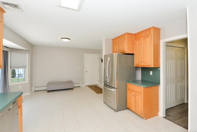 kitchen with stainless steel refrigerator with ice dispenser, a baseboard radiator, dark countertops, baseboards, and open floor plan