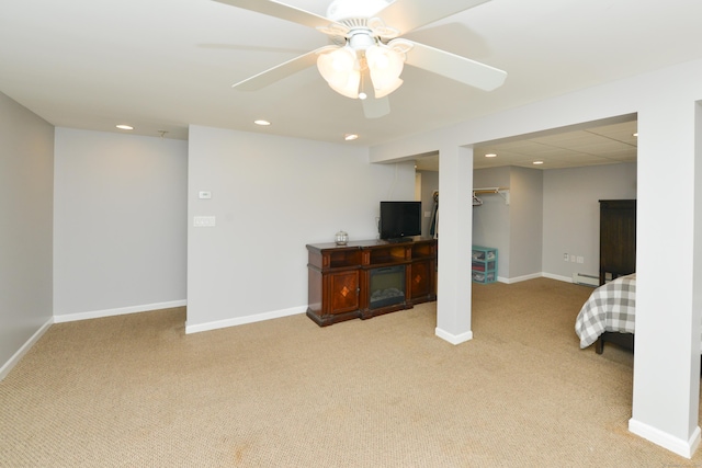 finished basement featuring light colored carpet, recessed lighting, baseboards, and baseboard heating