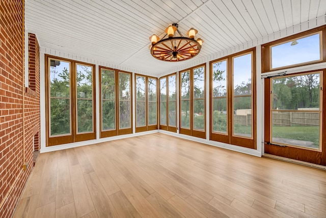 636 Thompson Rd, Thompson, CT 06277 - unfurnished sunroom featuring brick wall, wooden ceiling, a chandelier, and wood finished floors