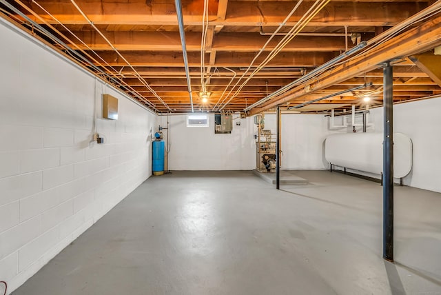 636 Thompson Rd, Thompson, CT 06277 - basement featuring oil tank, electric panel, and concrete block wall