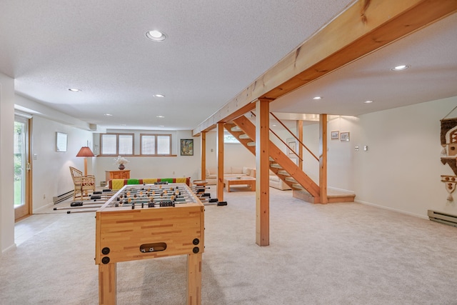recreation room featuring light colored carpet, recessed lighting, a textured ceiling, baseboards, and a baseboard heating unit