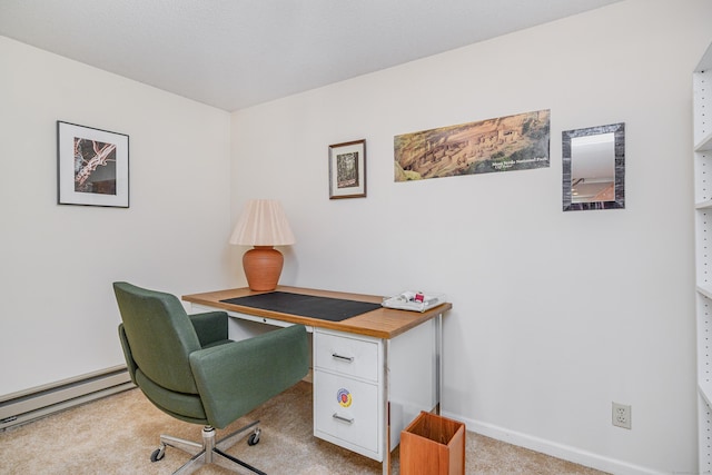 office space with light carpet, baseboard heating, and baseboards